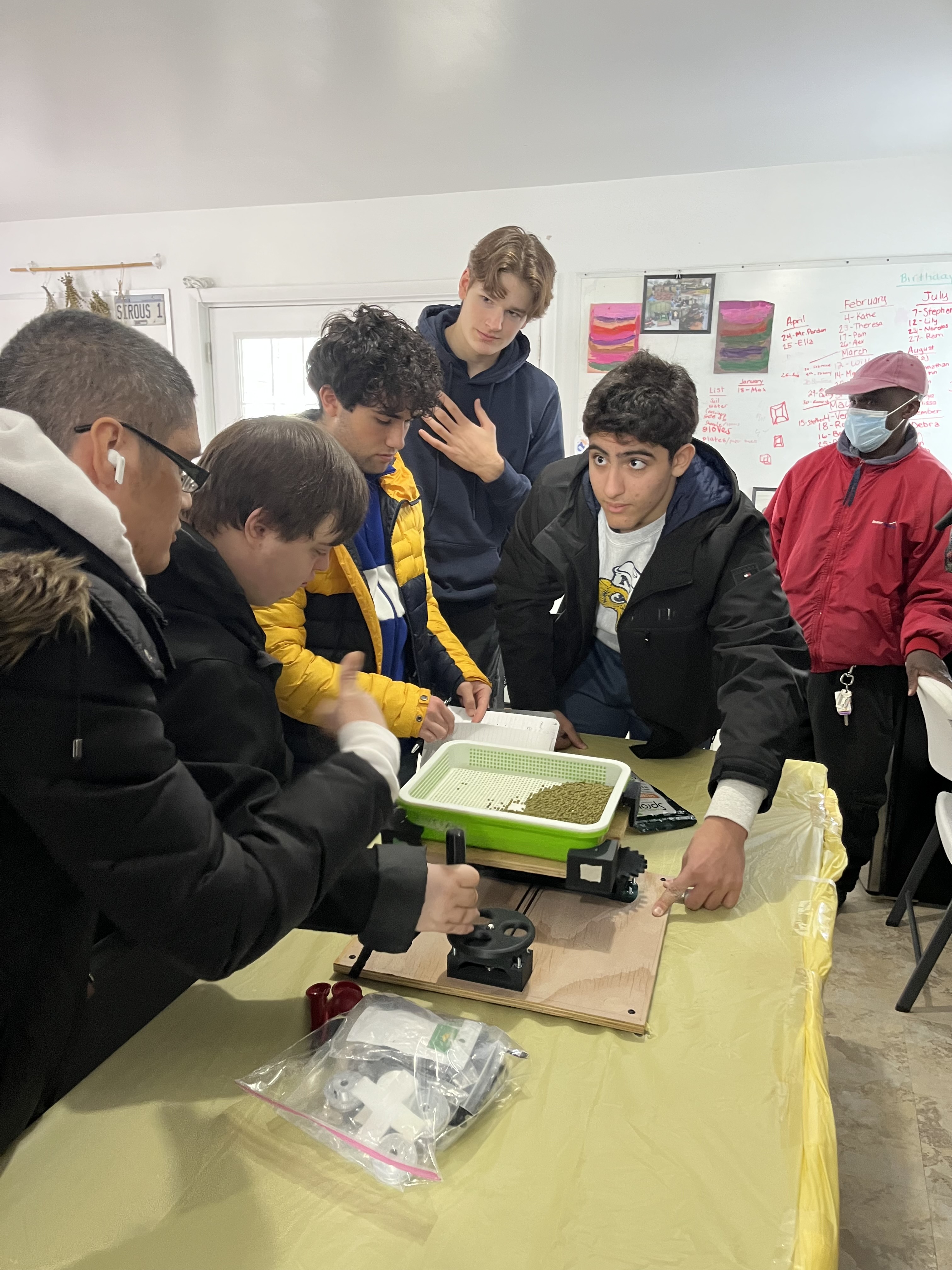 Engineering students presenting their microgreens system design